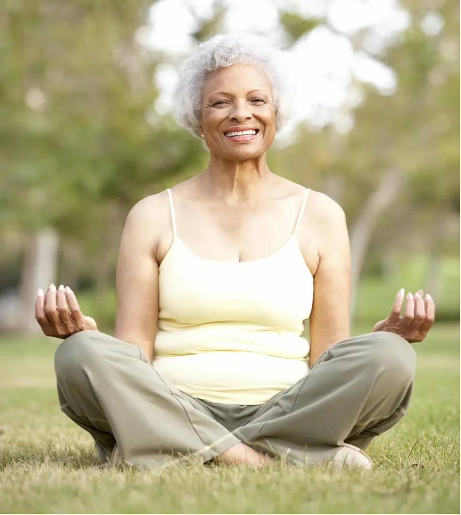 older woman balancing yoga